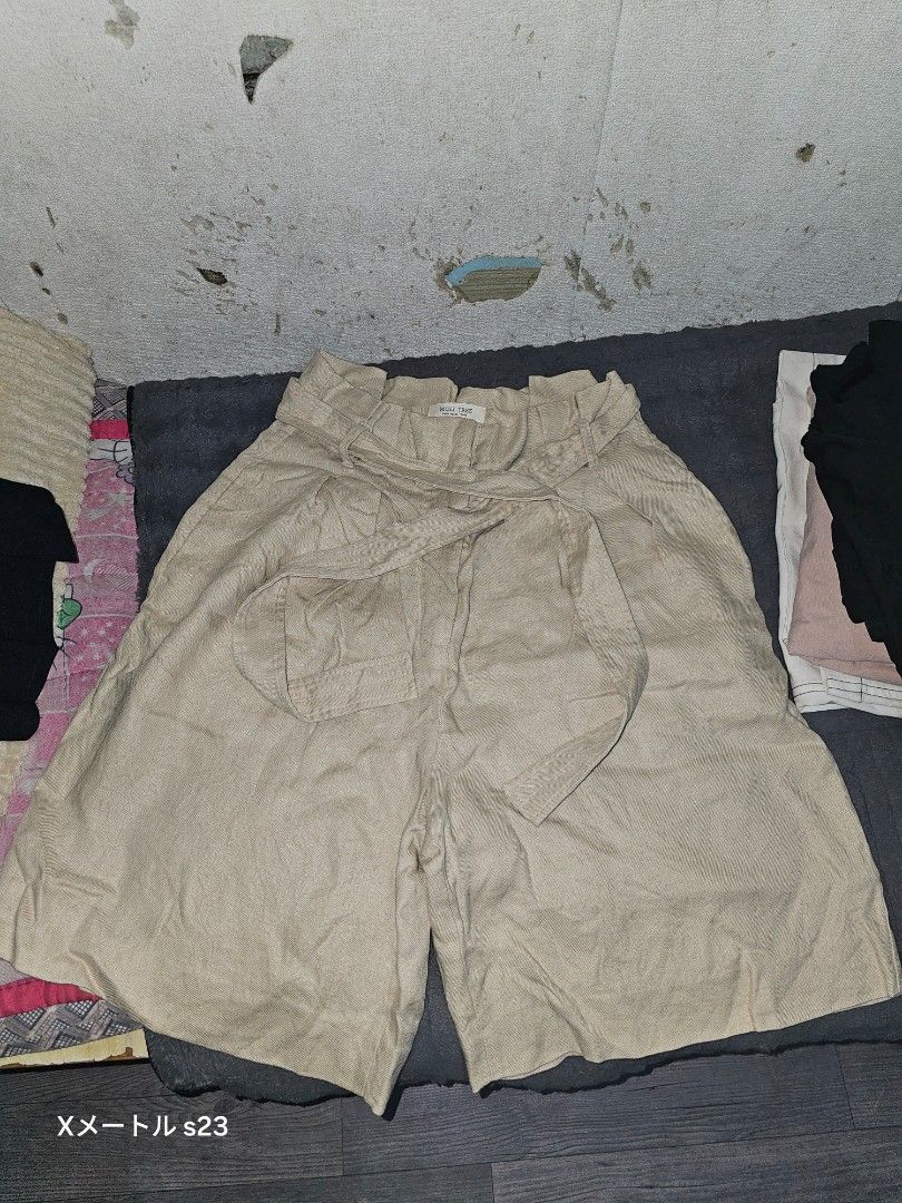 Women Shorts Bundle White and Beige (Category: Shorts) located in Manila. Submitted by billydelar93312 (Listing ID 1468360728, Image 2). Description: 26 - Bundle includes 2 pairs of versatile summer shorts - Pair 1: Classic white cuffed shorts with belt loops - Pair 2: Trendy beige high-waisted paperbag shorts with a tie belt and front pockets - Great staple pieces for warm-weather outfits - Easy to mix and match with various tops - Condition: Ex