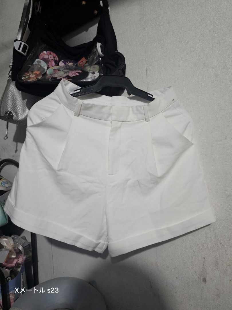 Women Shorts Bundle White and Beige (Category: Shorts) located in Manila. Submitted by billydelar93312 (Listing ID 1468360728, Image 1). Description: 26 - Bundle includes 2 pairs of versatile summer shorts - Pair 1: Classic white cuffed shorts with belt loops - Pair 2: Trendy beige high-waisted paperbag shorts with a tie belt and front pockets - Great staple pieces for warm-weather outfits - Easy to mix and match with various tops - Condition: Ex