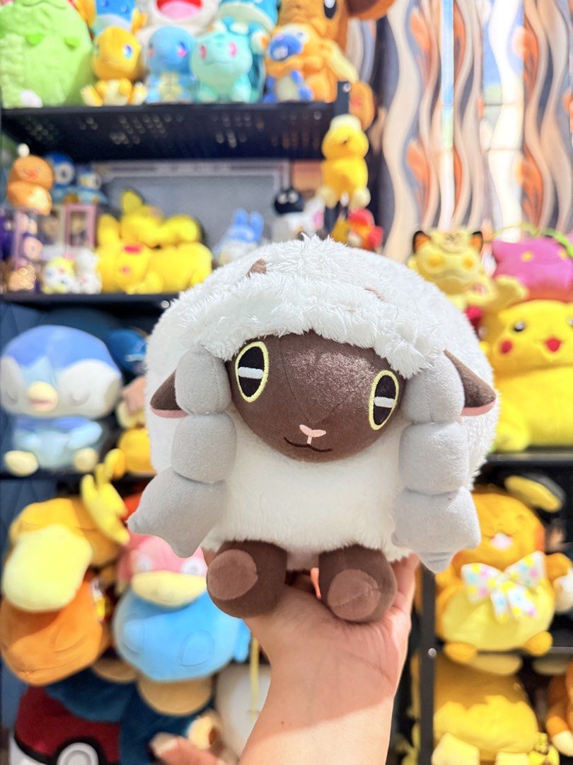 Wooloo Pokemon Plush Toy (Category: Plushies & Soft Toys) located in Cavite. Submitted by projectplushie (Listing ID 1468383722, Image 1). Description: - Item: Authentic Pokemon Wooloo Plush - Appearance: Soft white fleece body, brown face, yellow eyes, grey horns, and brown paws - Condition: Clean, well-kept on a shelf in a smoke-free environment - Perfect for: Pokemon collectors and fans.