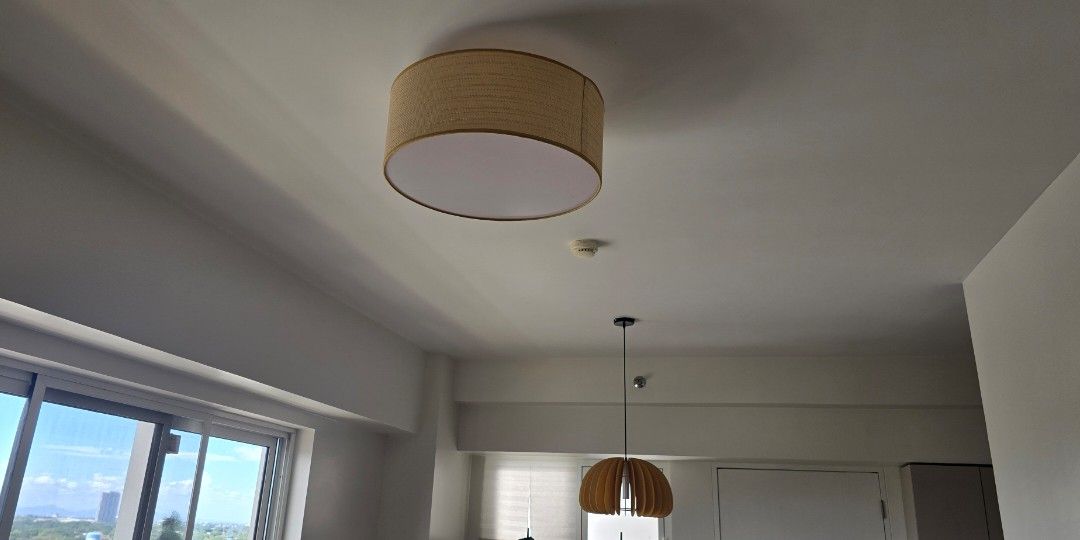 Woven Rattan Flush Mount Ceiling Light Fixture (Category: Lighting) located in Manila. Submitted by vi_ka (Listing ID 1468295158, Image 2). Description: - Style: Bohemian, Japandi, and minimalist flush mount ceiling light - Design: Natural woven rattan shade with a bottom white acrylic diffuser for soft illumination - Ideal for: Living rooms, bedrooms, and hallways - Matching: Easily complements wooden furniture and neutral home decor -50cm - Con