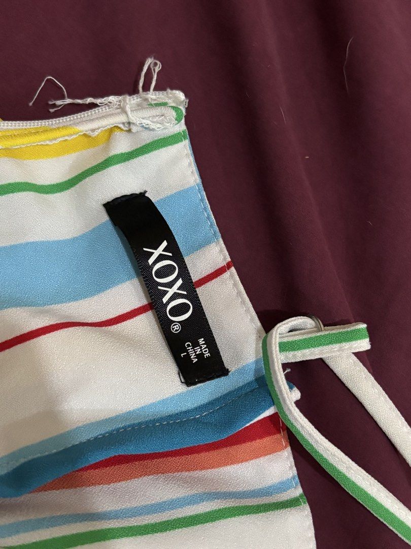 XOXO Striped Romper with Overlay Size L (Category: Rompers) located in Subic. Submitted by kai000. (Listing ID 1468404849, Image 3). Description: Only used once❗️ - Brand: XOXO - Size: L (tag attached) - Design: Multicolor striped summer romper with a sheer overlay skirt (dress effect) - Details: Spaghetti straps, V-neckline with white lace trim, and back zip closure - Fabric: Lightweight and bright, ideal for sunny days and outings.
