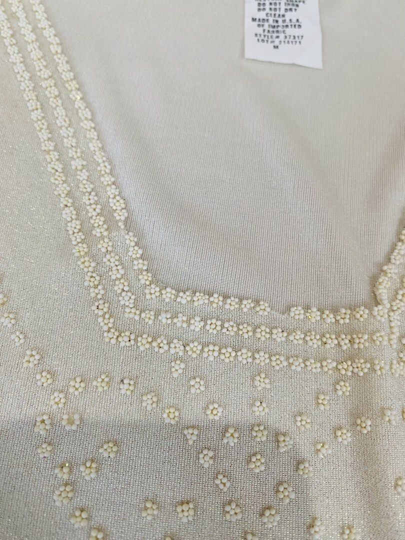 Y2k Beaded White Sleeveless Top Size M (Category: Sleeveless) located in Vigan. Submitted by yourcloset1001 (Listing ID 1468468337, Image 2). Description: - Brand: S. Levine - Color: White - Size: M (Made in USA) - Material: 95% polyester, 5% spandex (lightweight with stretch) - Design: Scoop neck with intricate beadwork along the neckline and a pointed, zigzag beaded hemline - Condition: Excellent pre-loved condition - Perfect for casual outings