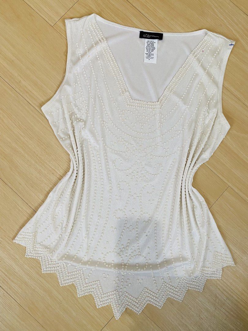 Y2k Beaded White Sleeveless Top Size M (Category: Sleeveless) located in Vigan. Submitted by yourcloset1001 (Listing ID 1468468337, Image 1). Description: - Brand: S. Levine - Color: White - Size: M (Made in USA) - Material: 95% polyester, 5% spandex (lightweight with stretch) - Design: Scoop neck with intricate beadwork along the neckline and a pointed, zigzag beaded hemline - Condition: Excellent pre-loved condition - Perfect for casual outings