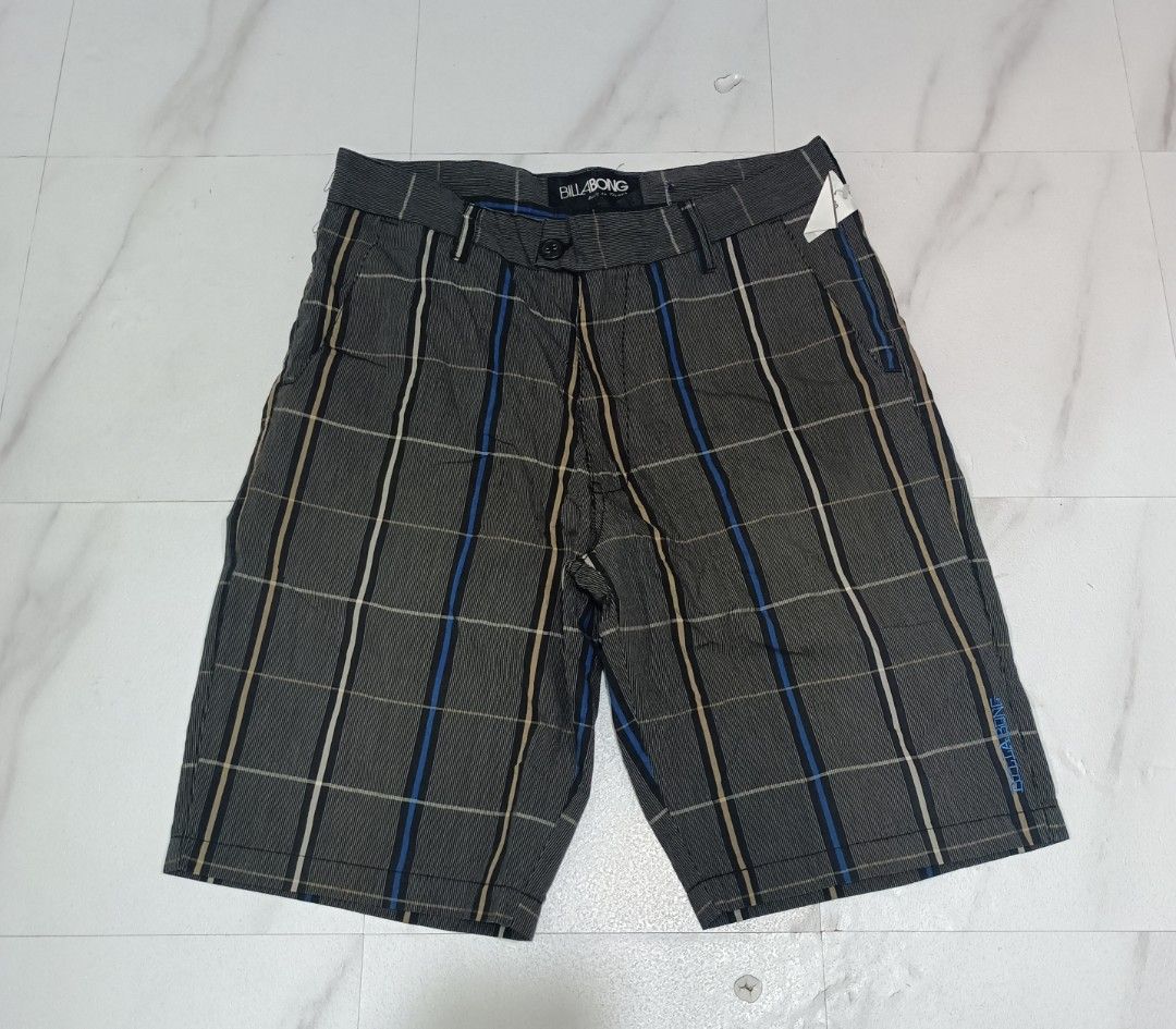 Y2K Billabong checkered short (Category: Shorts) located in Davao. Submitted by zion_thrift.PH (Listing ID 1468320582, Image 1). Description: Y2K Billabong checkered short Waist 33 to 35 Length 22. Excellent condition 📌550 plus SF Davao city location - Brand: Billabong - Style: Plaid shorts (Style M208JBRS) - Colorway: Black, grey, blue, and tan - Size: 33 waist - Material: 65% cotton, 35% polyester blend - Closure: Button closure with zip fly -