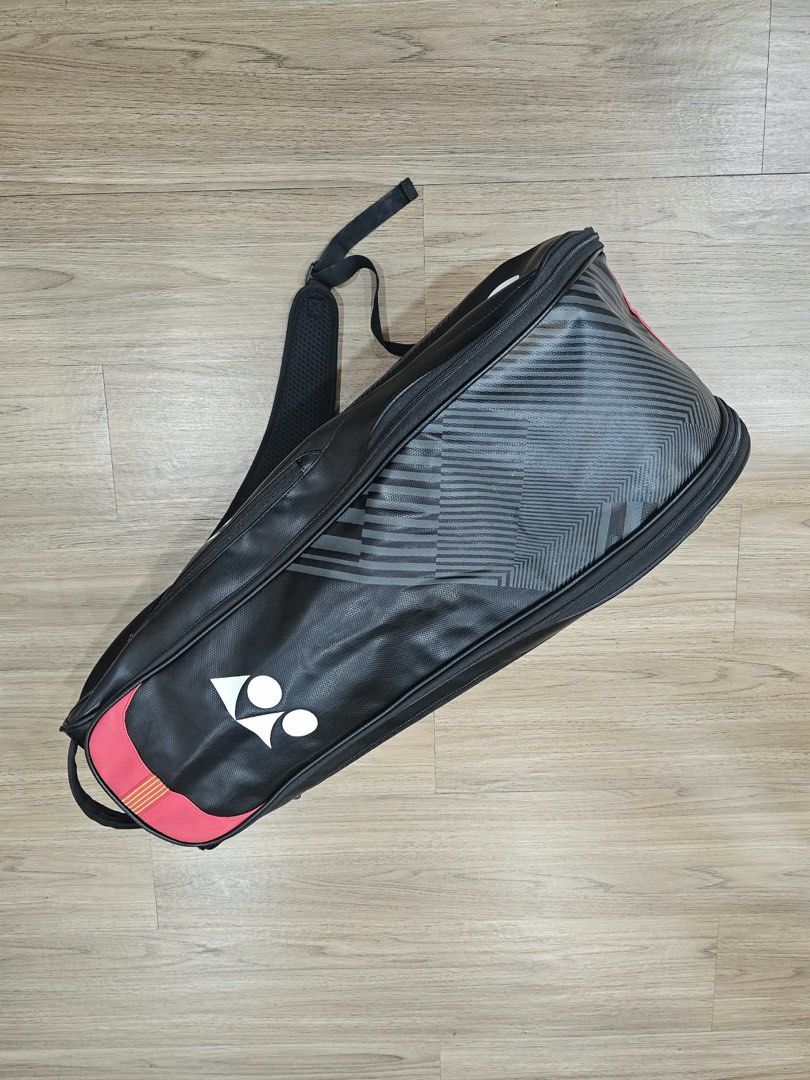Yonex Pro Tennis Bag (Category: Racket and Ball Sports) located in Quezon City. Submitted by chanelmonster (Listing ID 1468414993, Image 2). Description: - Yonex racket bag in black and red - Large main compartments for tennis rackets, tennis balls, shoes and apparel - Comfortable adjustable padded shoulder straps - Bold Yonex branding with textured exterior - Zippers, straps, and structure are fully functional - Original price is Php 2,500 (sell
