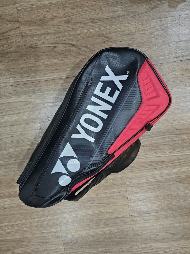 Yonex Pro Tennis Bag (Category: Racket and Ball Sports) located in Quezon City. Submitted by chanelmonster (Listing ID 1468414993, Image 1). Description: - Yonex racket bag in black and red - Large main compartments for tennis rackets, tennis balls, shoes and apparel - Comfortable adjustable padded shoulder straps - Bold Yonex branding with textured exterior - Zippers, straps, and structure are fully functional - Original price is Php 2,500 (sell