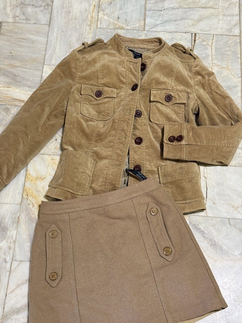 Zara Basic jacket and Topshop skirt set brown (Category: Coats, Jackets and Outerwear) located in Pozorrubio. Submitted by christajoi79316 (Listing ID 1468345044, Image 1). Description: - Brand/Item 1: Zara Basic brown corduroy jacket with utility pockets, shoulder epaulets, and brown buttons - Brand/Item 2: Topshop wool-blend mini skirt with button-detailed front panels and A-line cut - Color: Warm neutral tone, ideal for autumn weather - Condit