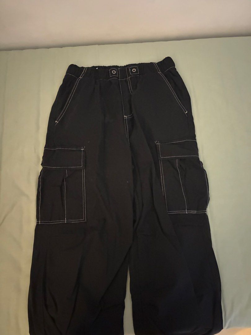 Zara black cargo pants contrast stitching size S (Category: Jeans) located in Manila. Submitted by silverjubilee (Listing ID 1468334007, Image 1). Description: Black cargo pants from Zara with contrast white stitching. Size S, EUR S, USA S. Elastic waistband with snap buttons. Multiple utility pockets on the sides and back. Relaxed fit through the legs. Comfortable everyday streetwear piece..