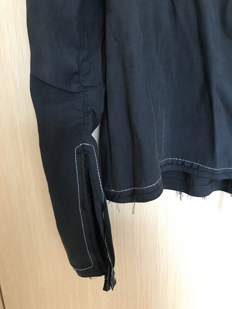 Zara Black Lace-Up Blouse Size M (Category: Blouses) located in Cainta. Submitted by ukaymama (Listing ID 1468295589, Image 3). Description: - Brand: Zara - Size: M (Condition: Brand new with tags) - Color: Black with contrast white stitching - Design: Front lace-up tie closure, long sleeves with slit cuffs, and a trendy raw frayed hem - Material: Lightweight and comfortable fabric.