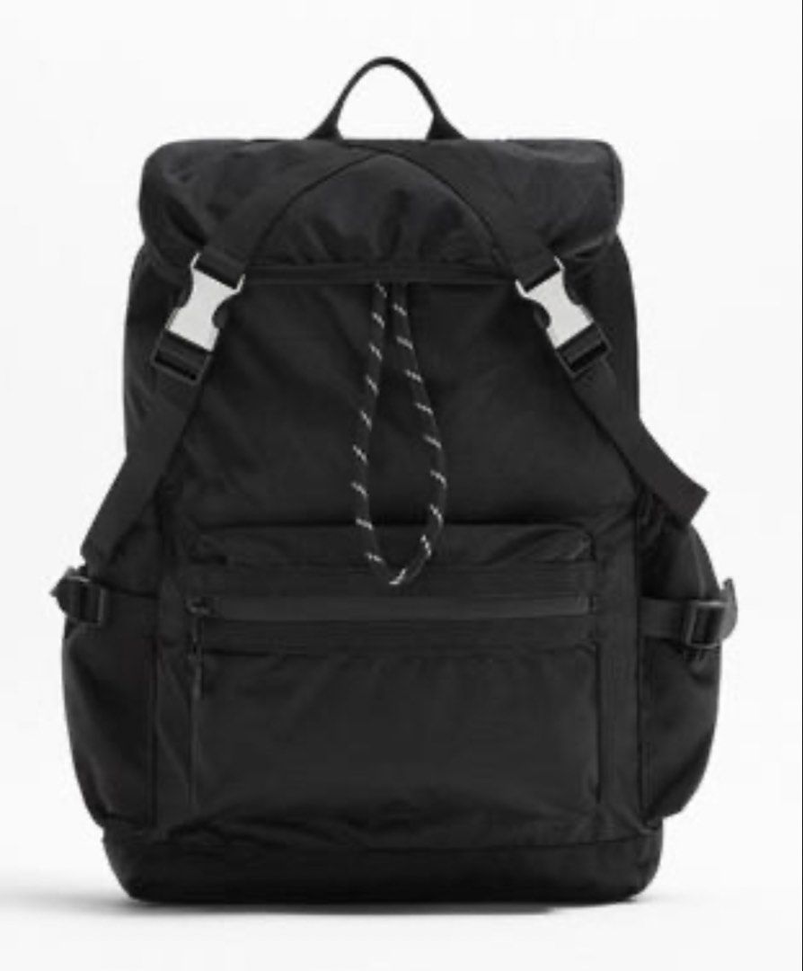 Zara Black Nylon Explorer Backpack (Category: Backpacks) located in Legazpi City. Submitted by mechan88 (Listing ID 1468293044, Image 1). Description: - Color/Material: Durable black nylon - Closure: Drawstring top with crisscross buckle straps - Pockets: Front zippered pocket with a decorative black & white cord, plus adjustable side pockets - Comfort: Padded shoulder straps and convenient top grab handle - Condition: Impeccably clean exterior a