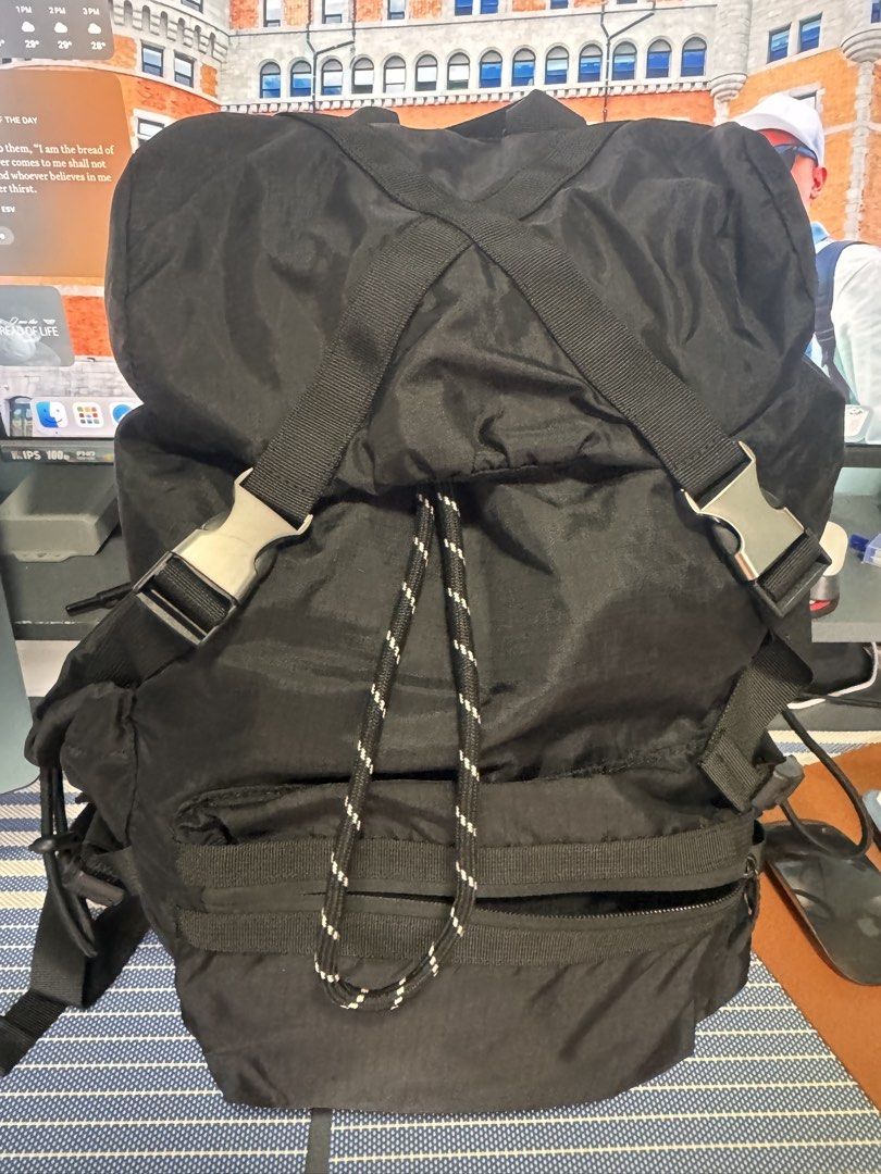Zara Black Nylon Explorer Backpack (Category: Backpacks) located in Legazpi City. Submitted by mechan88 (Listing ID 1468293044, Image 2). Description: - Color/Material: Durable black nylon - Closure: Drawstring top with crisscross buckle straps - Pockets: Front zippered pocket with a decorative black & white cord, plus adjustable side pockets - Comfort: Padded shoulder straps and convenient top grab handle - Condition: Impeccably clean exterior a