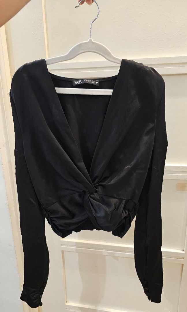 Zara Black Satin Knot Crop Top (Category: Blouses) located in Santa Rosa. Submitted by love.princess (Listing ID 1468335301, Image 1). Description: Brandnew, no more tags. S-M - Brand: Zara - Size: XS (Fit up to medium) - Material: Luxurious satin fabric - Origin: Made in Turkey - Design: Deep V-neckline with trendy front knot detail - Fit: Smocked elastic band at the back hem for extra comfort - Styling: Ideal for night outs or styling with high