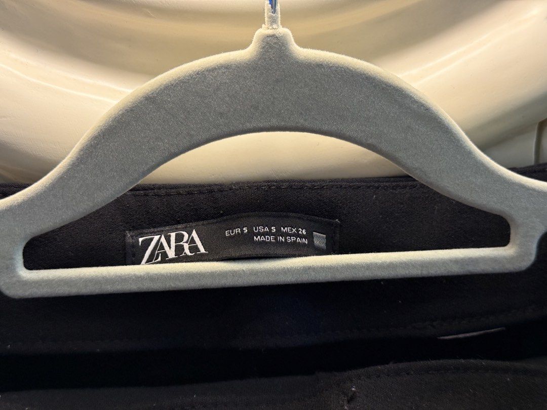 Zara Black Skort Size S (Category: Skirts) located in Angeles City. Submitted by adeclutters__ (Listing ID 1468343967, Image 3). Description: - Brand: Zara - Style: Black skort with front wrap design, subtle slit, and back shorts look - Size: EUR S / USA S / MEX 26 - Details: Side zipper closure, made in Spain - Versatility: Great basic piece for both casual days and dressy occasions.