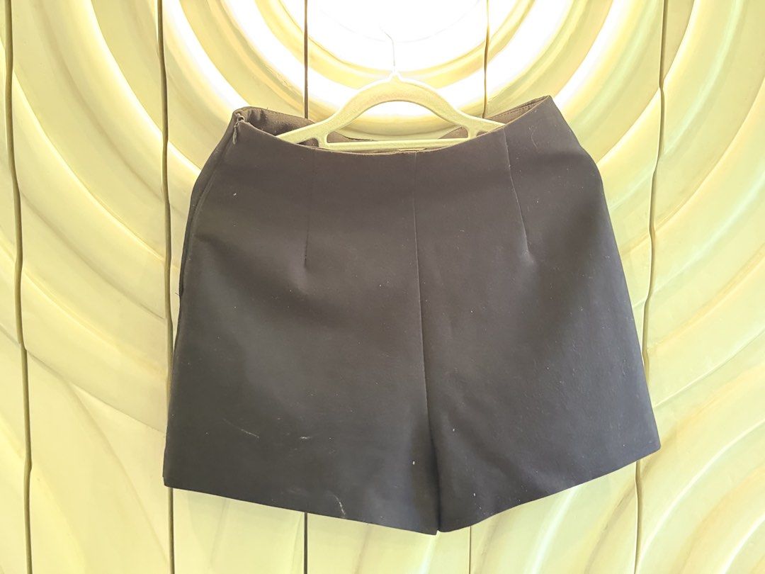 Zara Black Skort Size S (Category: Skirts) located in Angeles City. Submitted by adeclutters__ (Listing ID 1468343967, Image 2). Description: - Brand: Zara - Style: Black skort with front wrap design, subtle slit, and back shorts look - Size: EUR S / USA S / MEX 26 - Details: Side zipper closure, made in Spain - Versatility: Great basic piece for both casual days and dressy occasions.