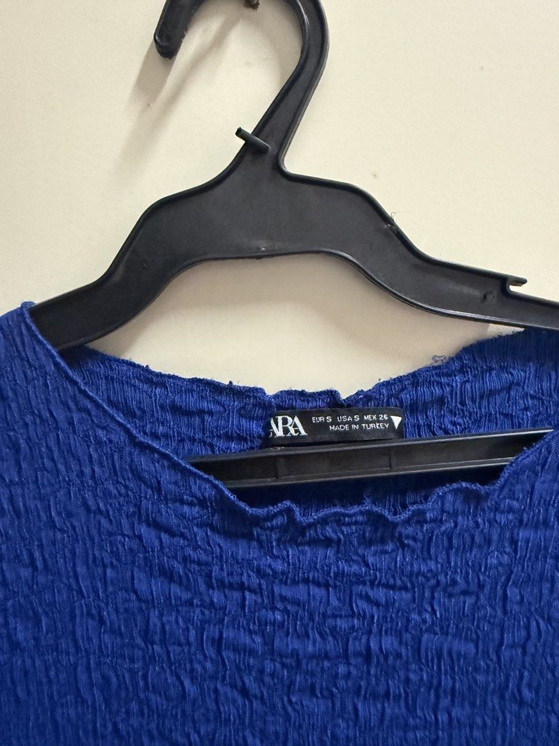 Zara Blue Crinkle Texture Midi Dress Size Small (Category: Dresses) located in Quezon City. Submitted by mikaela_0 (Listing ID 1468356137, Image 2). Description: - Brand: Zara - Size: EUR S / US S / MEX 26, fits small to medium - Color: Vibrant blue - Material: Stretchy crinkle fabric - Design: Round neckline, short cap sleeves, mid-length body-hugging cut - Origin: Made in Turkey - Condition: Clean and ready to wear Excellent condition.