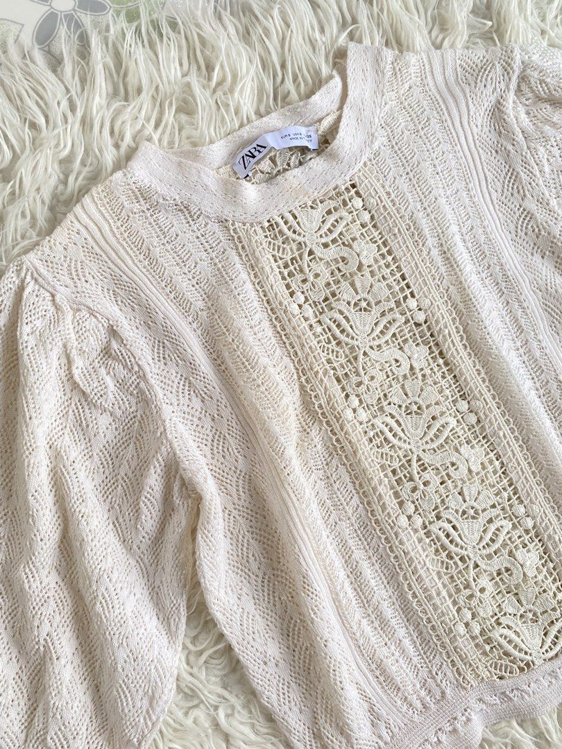 Zara Cream Knit Top with Lace Panel Size S (Category: Blouses) located in Tabaco. Submitted by camila_dp (Listing ID 1468285869, Image 3). Description: Zara Cream Knit Top with Lace Panel Size S - Brand: Zara - Size: S (fits true to size) - Color: Cream - Material/Style: Crochet knit with detailed center lace panel - Features: Puff sleeves with ribbed cuffs and round neckline - Origin: Made in Turkey - Condition: Great piece for layering or weari