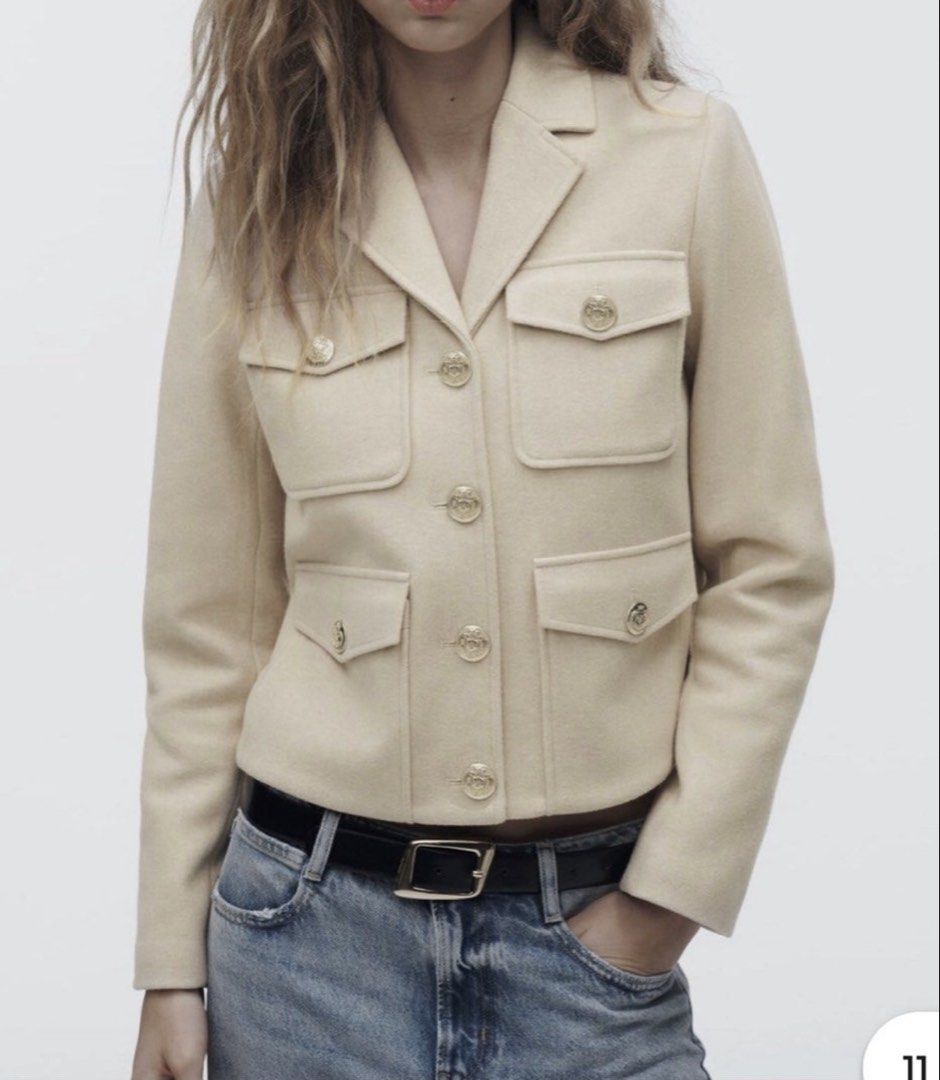 Zara Cropped Wool Blend Jacket with Gold Buttons Beige (Category: Coats, Jackets and Outerwear) located in Makati City. Submitted by bibas.corner (Listing ID 1468442777, Image 2). Description: - Brand/Style: Zara cropped jacket in neutral beige - Design: Tailored lapel collar with structured shoulders - Details: Four front flap pockets with chic embossed gold metal buttons - Fit: Clean silhouette finishing right at the waistline - Styling: Perfec