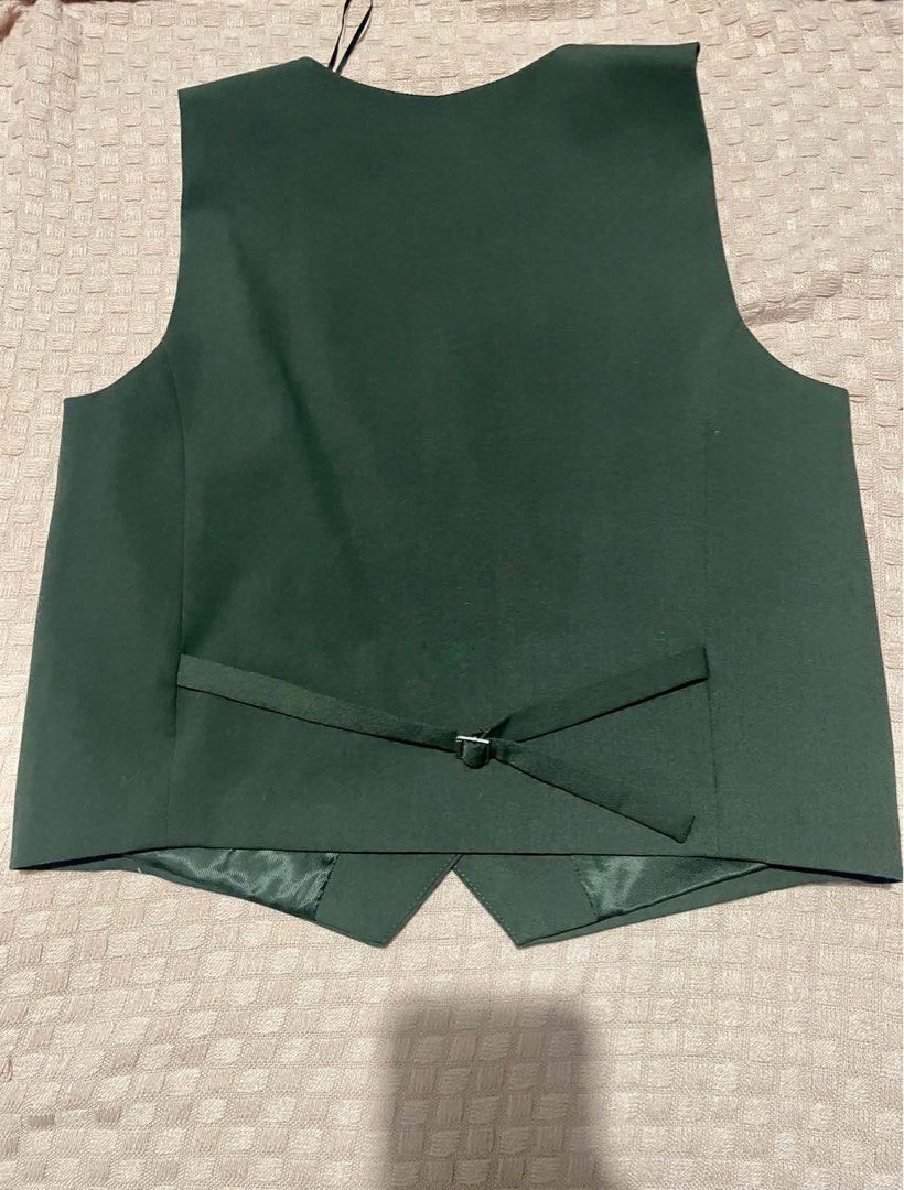 Zara Dark black Suit Vest Size M (Category: Sleeveless) located in Quezon City. Submitted by geohdz (Listing ID 1468309412, Image 3). Description: - Brand: Zara - Size: Medium (M) - Color: black greyish - Closure: Four-button front - Pockets: Two functional welt pockets - Details: Adjustable back strap with silver hardware, fully lined interior - Styling: Classic tailored fit, perfect for layering over shirts or wearing solo.