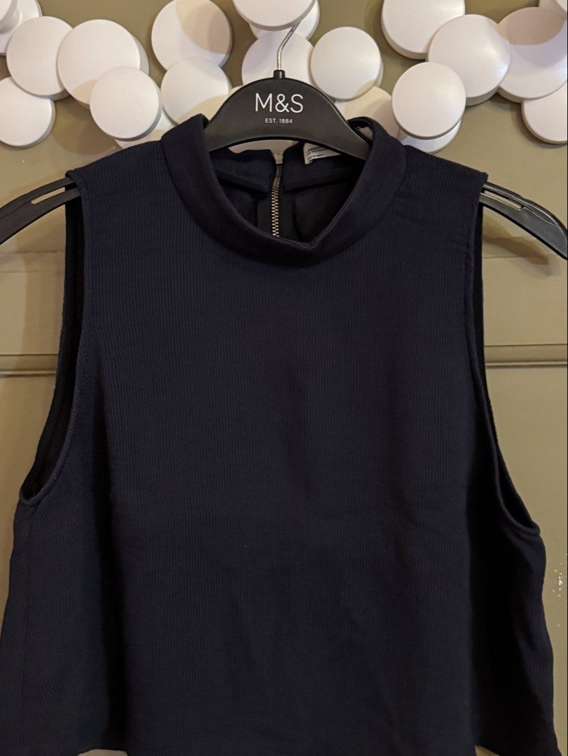 Zara Premium Collection (Category: Sleeveless) located in Manila. Submitted by gabwie (Listing ID 1468411136, Image 1). Description: - Brand: Zara Woman Mock Neck Top - Color: Navy blue - Material: Textured ribbed fabric - 2nd photo: For reference only since top if kinda flowy at the bottom - Zara Premium : Bought for 2,995 - Very stylish !! - Needs ironing.