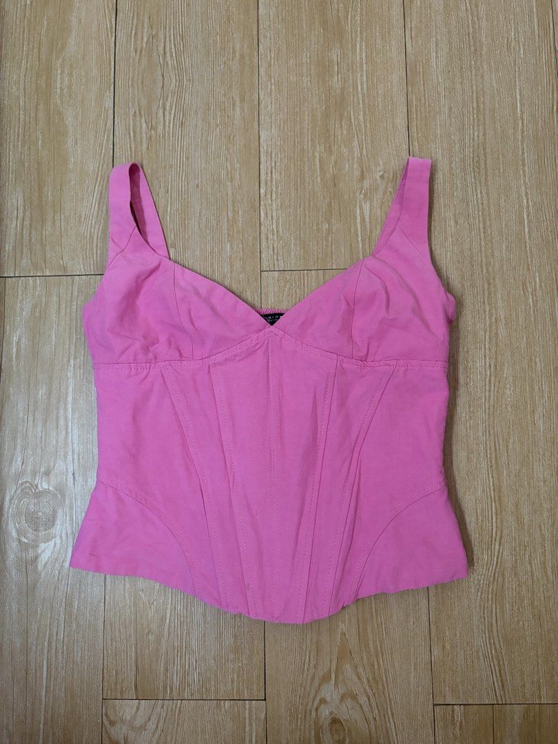Zara Pink Corset Tank Top (Category: Sleeveless) located in Marikina City. Submitted by phelinky_finds (Listing ID 1468336648, Image 1). Description: 🛍️ DESCRIPTION: - Brand: Zara - Size: XS - Color: Vibrant bright pink - Style: Corset-style top with structured bodice and vertical seams - Neckline & Straps: Sweetheart neckline with thick straps - Fit: Smocked elastic back panel for stretch and easy wear - Length: Cropped with a trendy curved hem