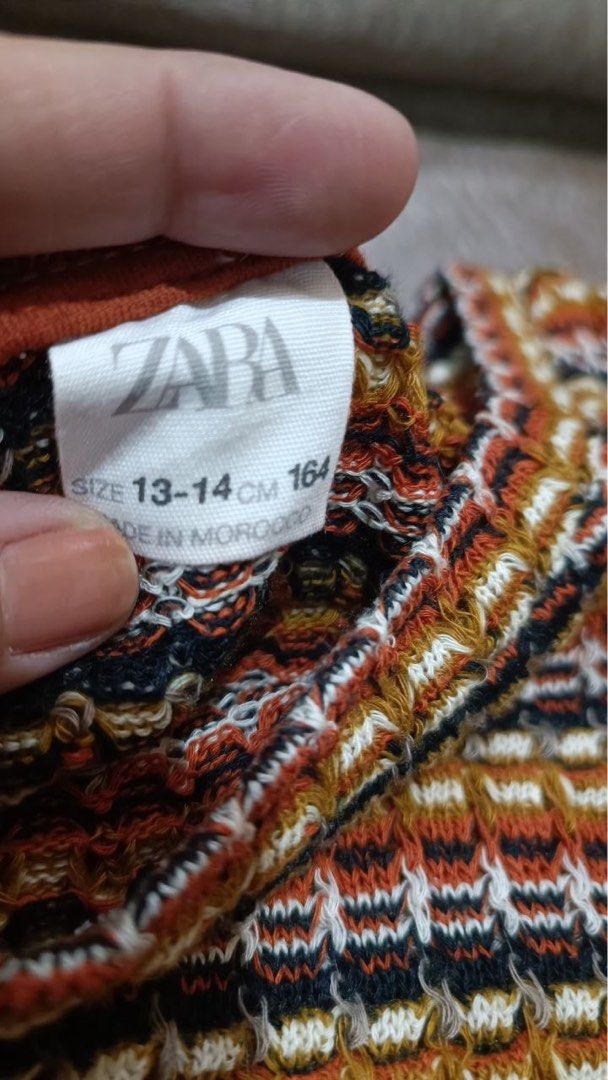 Zara Striped Knit Crop Top (Category: Sleeveless) located in Valenzuela. Submitted by nixs2722 (Listing ID 1468448584, Image 3). Description: -GC PAYMENT -SF c/o BUYERS - Brand: Zara - Style: Knit tank top with multi-color horizontal stripes (orange, mustard, white, black) - Neckline: Ribbed crew neck - Fit: Cropped length, sleeveless, soft textured fabric with great stretch - Size: 13-14 years / 164 cm (fits petite frames as well) - Origin: Made