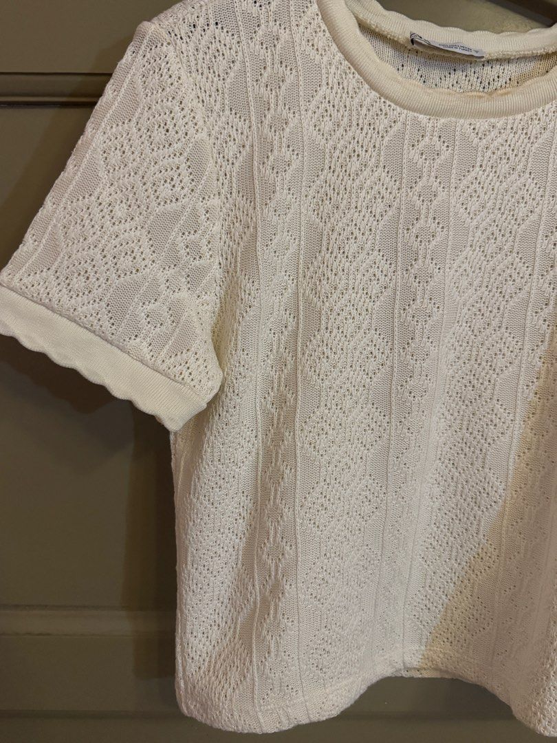 Zara White Knitted Short Sleeve Top (Category: Blouses) located in Manila. Submitted by gabwie (Listing ID 1468407613, Image 3). Description: - Brand: Zara - Color: Cream - USED ONCE ONLY - Size: L - Bought for 2,300 : Zara Glorietta - Material/Style: Open knit pattern with vertical ribbed details, short sleeves, and round neckline with ribbed trim - Condition: Stain around the inner collar area, can be removed with Zonrox.