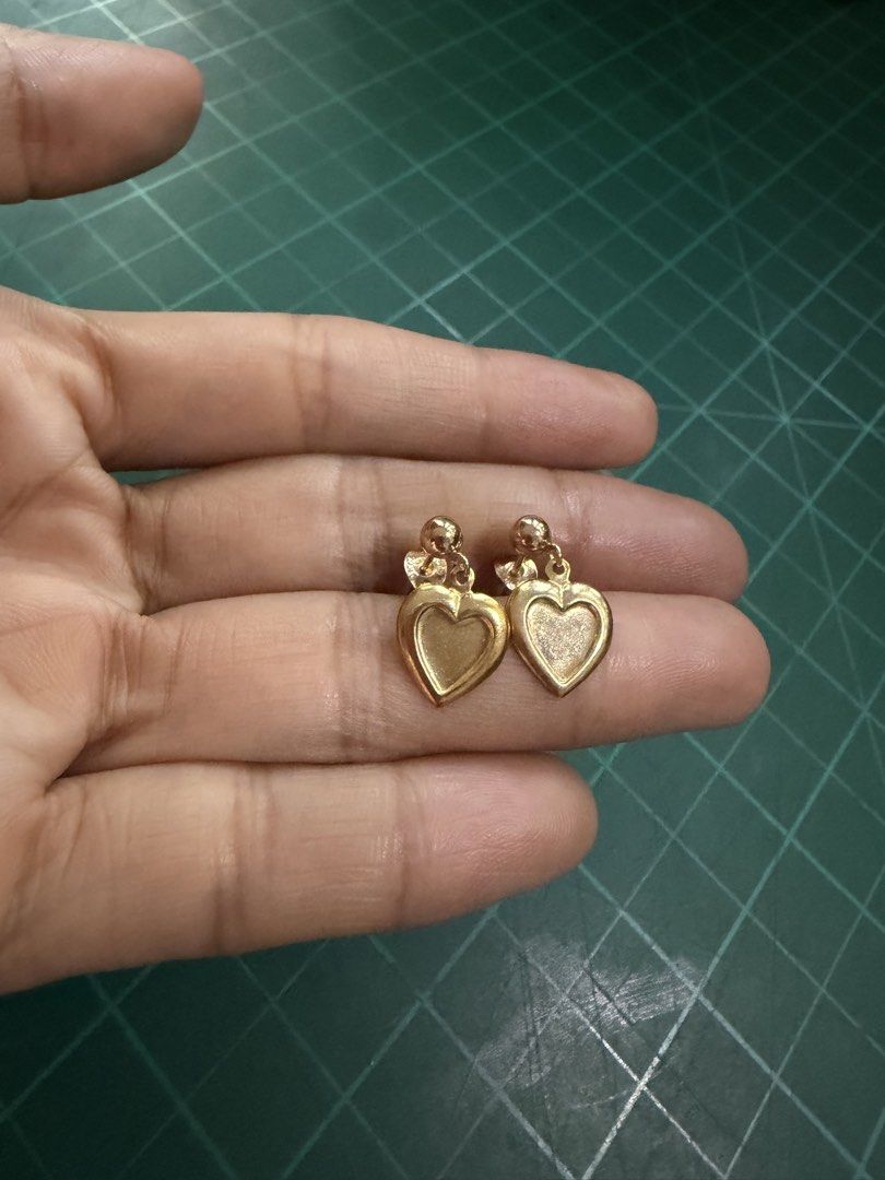 10k 5%gold filled Heart Dangle Stud Earrings (Category: Earrings) located in Caloocan City. Submitted by emz.collection (Listing ID 1468541199, Image 2). Description: - Gold-tone finish with sweet dangling heart charms - Ball stud design with secure post-back closure - Double-layered heart outline with a smooth center Pde sa bata matanda - Lightweight and easy to style for everyday wear - Clean condition with no major scratches or tarnishing.
