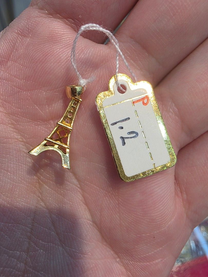 18k Eiffel Tower Gold Pendant 750 (Category: Necklaces) located in Manila. Submitted by trumpisthedevil (Listing ID 1468607659, Image 1). Description: - Material: Gold (Stamped 750 on bail) - Design: Detailed openwork Eiffel Tower with small stone accents - Weight: 1.2 grams (tag attached) - Condition: Clean and ready to wear - Note: Pendant only, chain not included.