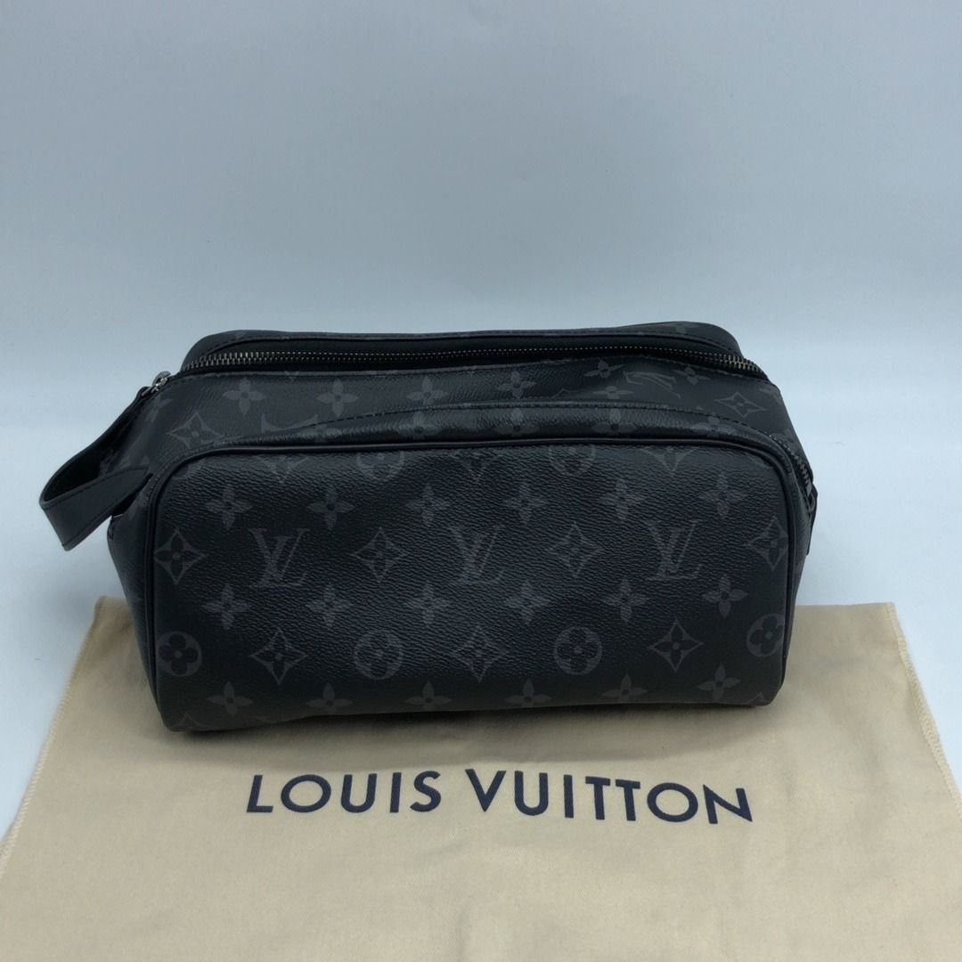 267010068 LOUIS VUITTON BAG MONOGRAM DOPP KIT ECLIPSE CANVAS M46354 (Category: Luxury Bags & Wallets) located in Taguig. Submitted by ecoring.ph (Listing ID 1468578493, Image 2). Description: ◆CONDITION: B+ ◆DESCRIPTIONS: (Other defects/info:) OUTER: The body of the pouch is slightly scratched and deformed, has press marks, and shows signs of use. The bottom and bottom corners of the pouch are slightly scuffed. The top handle and zipper puller of