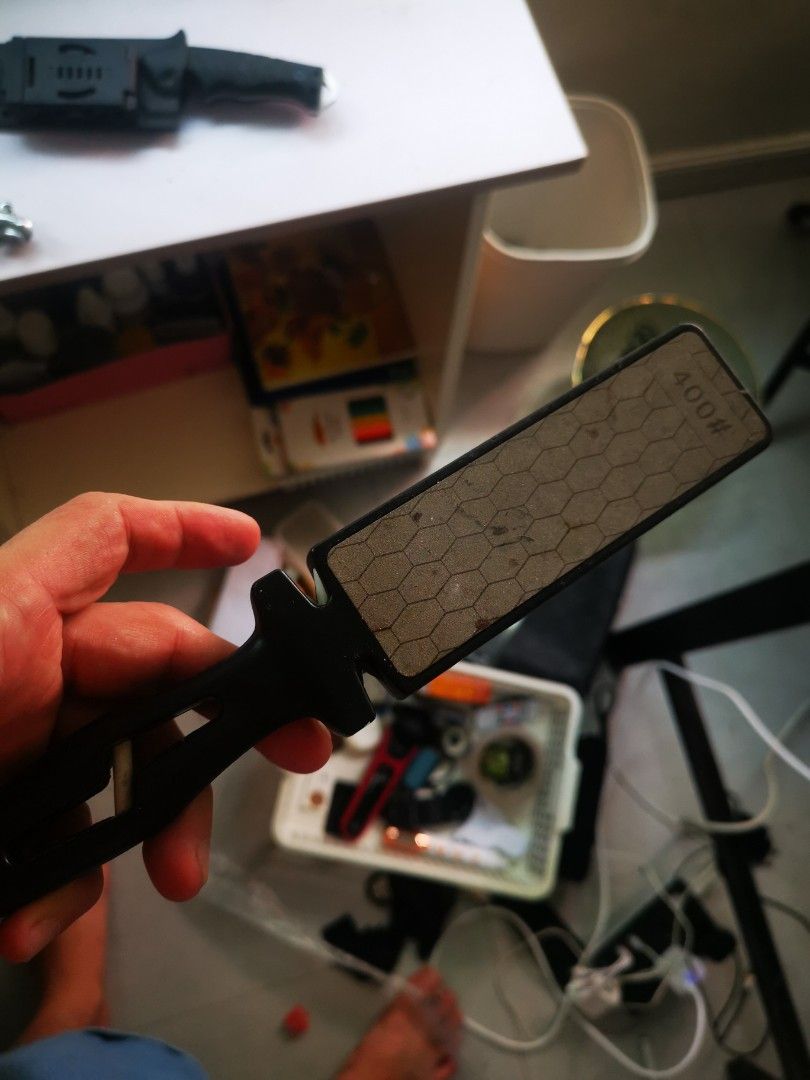 400# Grit Diamond Knife Sharpener Pocket Sharpening Tool (Category: Knives & Chopping Boards) located in Pasay City. Submitted by wizemindz138970 (Listing ID 1468590579, Image 2). Description: - Type: Handheld knife sharpener with 400 grit diamond surface - Design: Hexagonal pattern on the plate for efficient sharpening, features an ergonomic black plastic handle with a convenient lanyard hole - Versatility: Perfect for kitchen knives, pocket kni