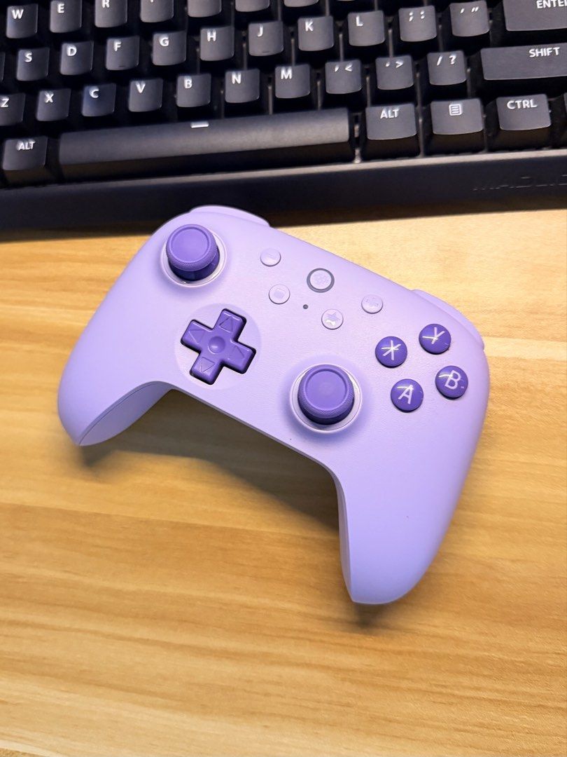 8BitDo Ultimate 2C Wired Controller - Purple (Controller Only) (Category: Controllers) located in Licab. Submitted by kmbrgz (Listing ID 1468666756, Image 1). Description: FIRM PRICE! Description: Selling my 8BitDo Ultimate 2C Wired Controller (Model 82CD) in the Purple color variant. This is a lag-free wired controller perfect for PC gaming, Android, and Raspberry Pi setups. It features premium Hall Effect joysticks and triggers to completely el