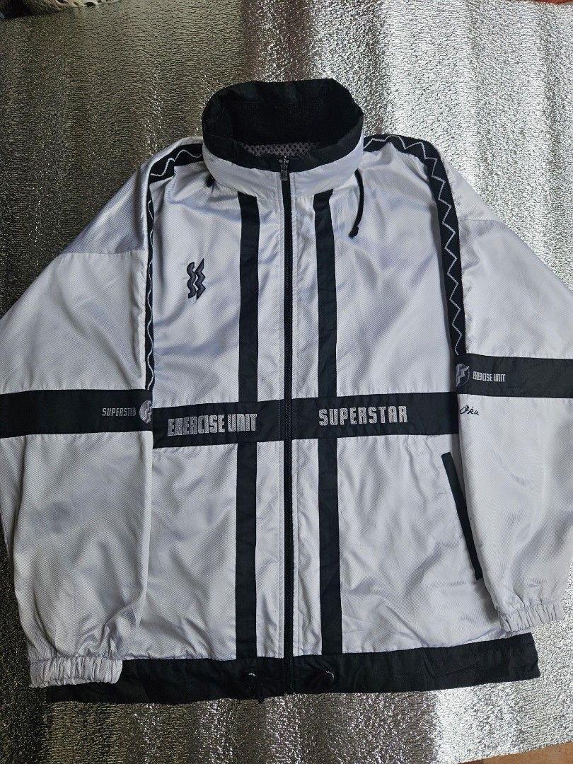 🎯 ARCHIVE TECH: Mizuno Superstar "Exercise Unit" Packable Jacket 🎯 (Category: Coats, Jackets and Outerwear) located in Las Pinas. Submitted by thriftedjacketsbybang (Listing ID 1468548259, Image 2). Description: 🎯 ARCHIVE TECH: Mizuno Superstar "Exercise Unit" Packable Jacket 🎯 Insane 90s archive layout featuring a bold light gray and black geometric cross-panel design. Fully loaded with technical details—including graphic sleeve typography, 