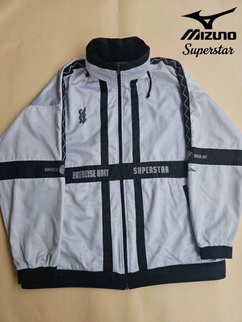 🎯 ARCHIVE TECH: Mizuno Superstar "Exercise Unit" Packable Jacket 🎯 (Category: Coats, Jackets and Outerwear) located in Las Pinas. Submitted by thriftedjacketsbybang (Listing ID 1468548259, Image 1). Description: 🎯 ARCHIVE TECH: Mizuno Superstar "Exercise Unit" Packable Jacket 🎯 Insane 90s archive layout featuring a bold light gray and black geometric cross-panel design. Fully loaded with technical details—including graphic sleeve typography, 