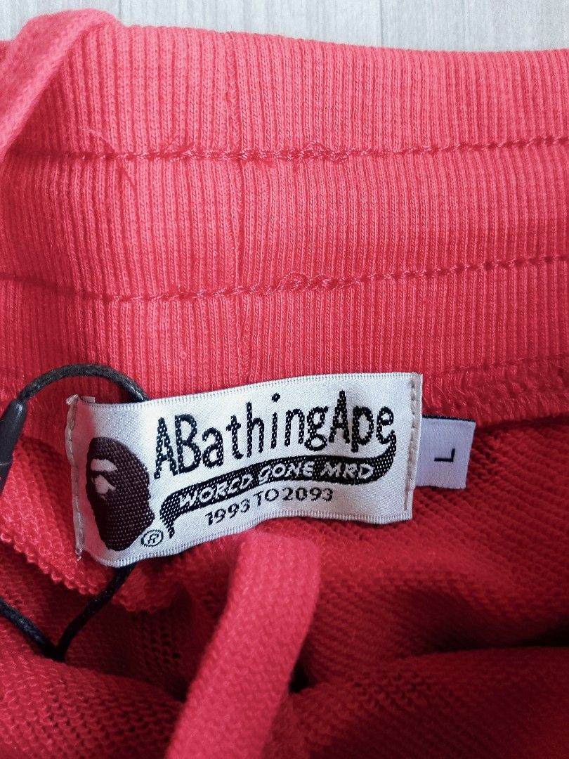 A Bathing Ape Bape Shark Camo Shorts (Category: Shorts) located in Batangas. Submitted by rafstaywitstaff_11 (Listing ID 1468585987, Image 2). Description: - Item: Bape Shark Camo Shorts - Design: Signature shark face graphic across the front - Colors: Available in various colors - Fit & Comfort: Elastic waistband with adjustable drawstring closure - Details: Woven logo tag on left hem with interior brand and size tags attached - Sizes: L and XL.