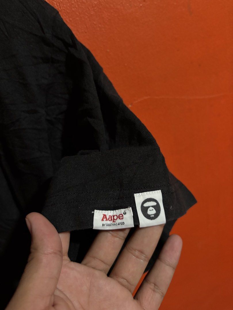 AAPE By A Bathing Ape Black T-Shirt (Category: Tshirts & Polo Shirts ) located in Naga. Submitted by ajrc.shop (Listing ID 1468521008, Image 3). Description: AAPE by A Bathing Ape Black Embossed T-Shirt ✅Size: L ✅Width: 21 ✅Length: 25.5 ✅Color Rate: 9.8/10 ✅Issue: None ✅Need Wash ✅Location: Bicol Naga City, Camarines Sur ✅Courier: J&T Express/Flash Express ✅MOP: Gcash only.