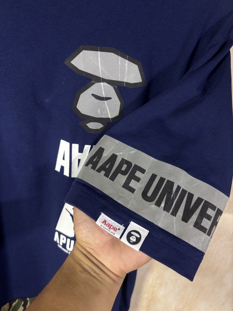 AAPE GRAPHIC SHIRT (Category: Tshirts & Polo Shirts ) located in Cabuyao City. Submitted by pormanation-thrift-store (Listing ID 1468622529, Image 3). Description: AAPE GRAPHIC SHIRT Condition: GOOD Color rate: 9/10 Size: MEDIUM Dimes: 20”Wx27”L Issue: MINIMAL CRACK SA PRINT ✅ Price: 800 .