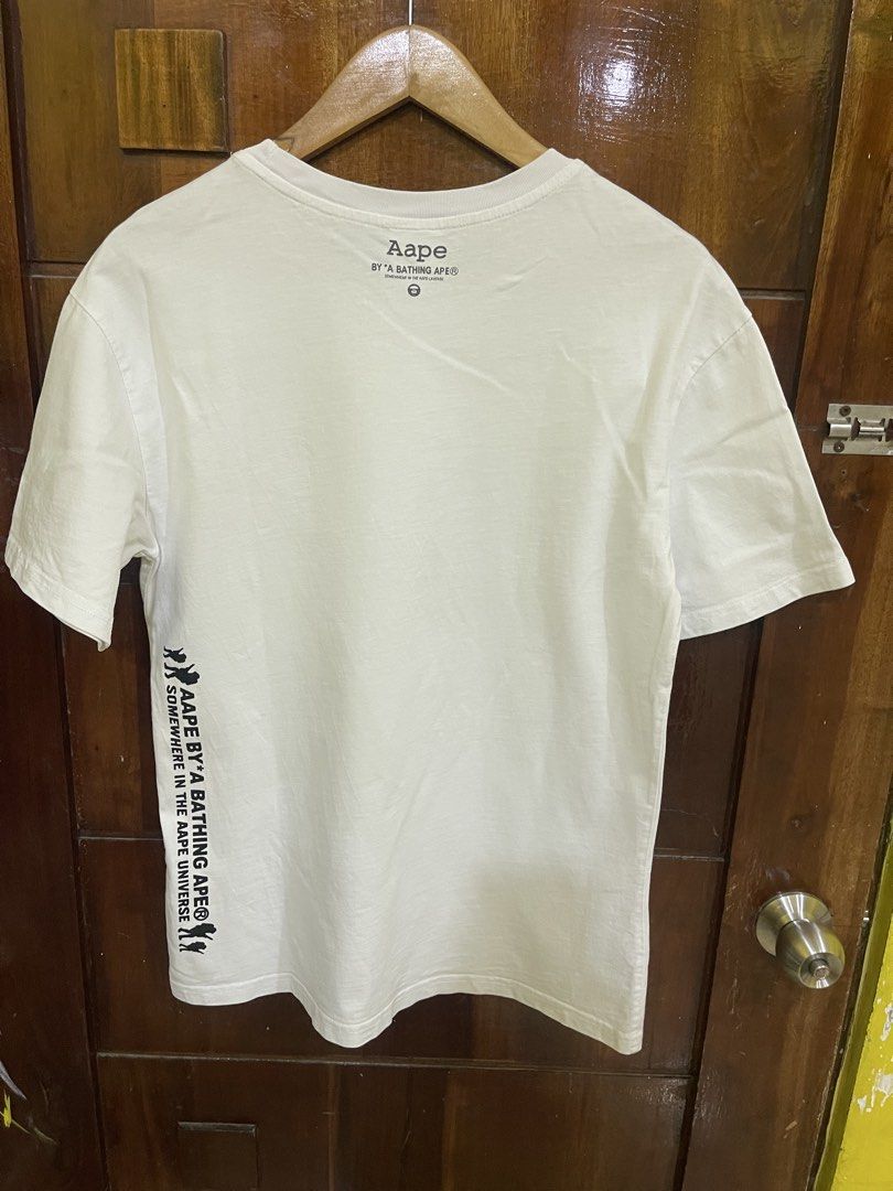 Aape Shirt (Category: Tshirts & Polo Shirts ) located in Marikina City. Submitted by greatfindsmnlph (Listing ID 1468506030, Image 2). Description: Aa pe Shirt Price: 280 Size: Medium Width: 19.5 Length: 28 Color: White Color Rate: 10/10 Condition: 9.9/10 cut washtag Very nice in actual.