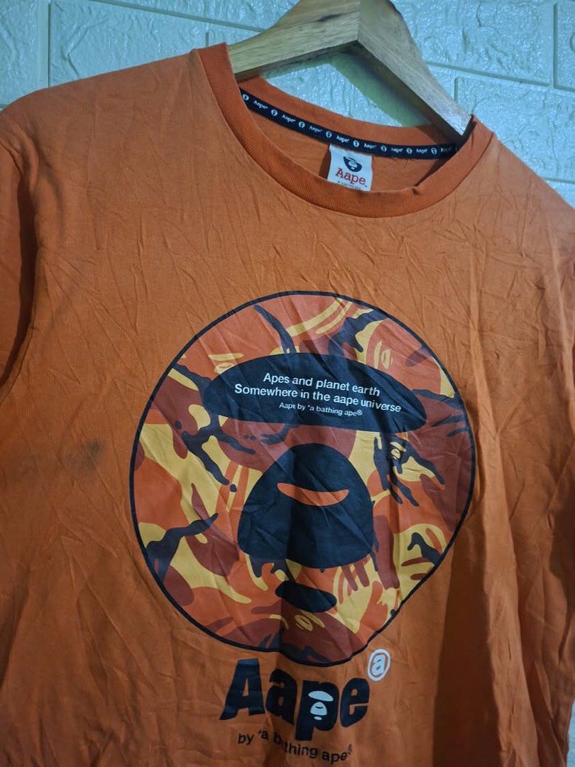 AAPE UNIVERSE TEE (Category: Tshirts & Polo Shirts ) located in Bulacan. Submitted by bleue.finds (Listing ID 1468581495, Image 3). Description: AAPE UNIVERSE TEE - 25 length - 19.5 width - minor black stain washable - good condition - no crack prints.