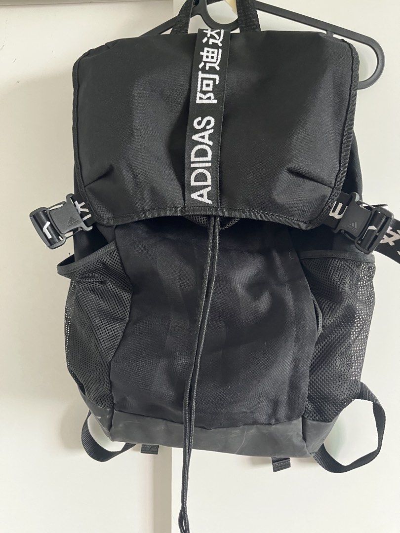 Adidas 4ATHLTS BP Black Backpack (Category: Backpacks) located in Mandaluyong City. Submitted by unomarcelo001 (Listing ID 1468540194, Image 2). Description: Adidas 4ATHLTS backpack in classic black. Built with mesh side pockets, adjustable buckle straps, and drawstring closure. Features bold Chinese character and Adidas lettering strap across the top flap. Tag inside reads 480 mm size. Made in Vietnam. Durable daily backpack with plenty of stora
