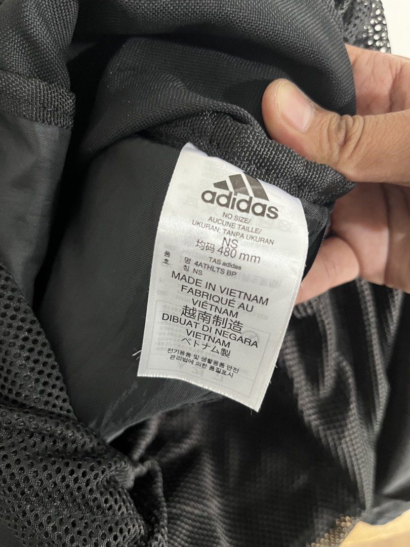 Adidas 4ATHLTS BP Black Backpack (Category: Backpacks) located in Mandaluyong City. Submitted by unomarcelo001 (Listing ID 1468540194, Image 3). Description: Adidas 4ATHLTS backpack in classic black. Built with mesh side pockets, adjustable buckle straps, and drawstring closure. Features bold Chinese character and Adidas lettering strap across the top flap. Tag inside reads 480 mm size. Made in Vietnam. Durable daily backpack with plenty of stora