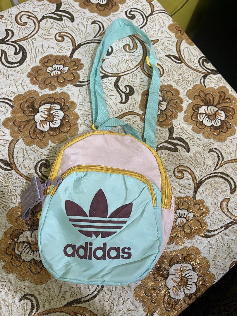 Adidas Bag (Category: Babies & Kids Fashion) located in Marikina City. Submitted by greatfindsmnlph (Listing ID 1468711381, Image 1). Description: Adi das Bag Price: 50 Size: Small Width: 9 Length: 10 Color: Multicolor Color Rate: 10/10 Condition: 9.5/10 nawala isang tali Very nice in actual.