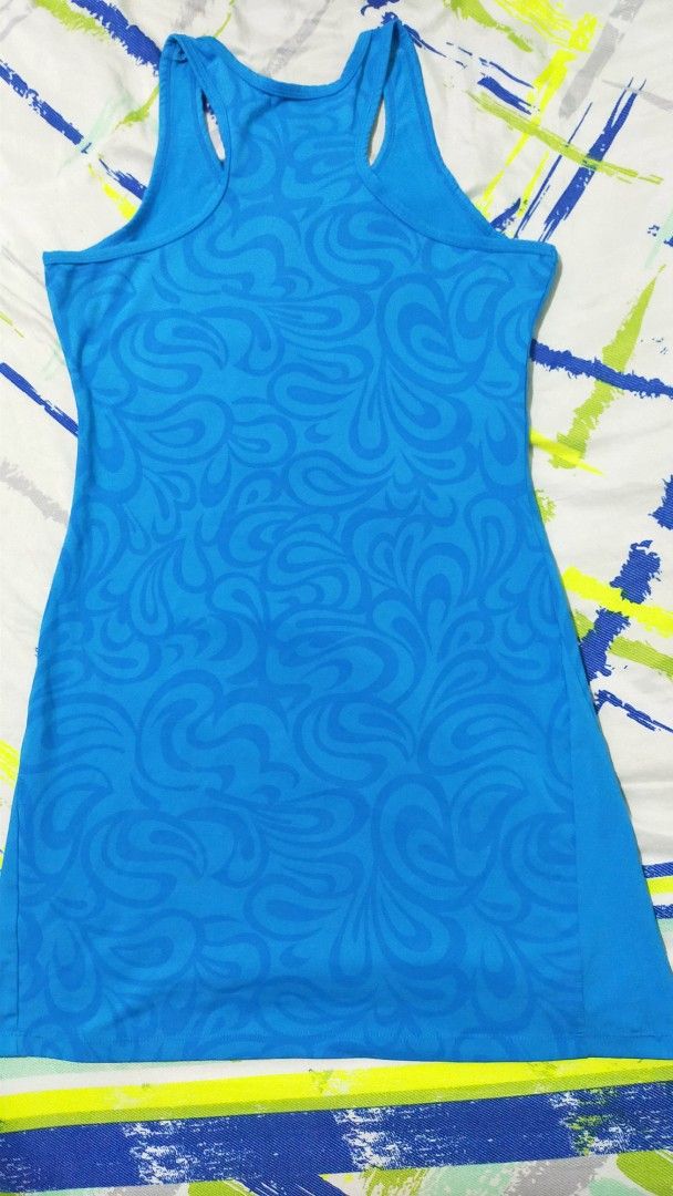 Adidas Climacool Blue dress (Category: Activewear) located in Manila. Submitted by angelcatam30011 (Listing ID 1468544912, Image 2). Description: Bright blue Adidas dress with a subtle tonal swirl pattern throughout. Racerback design for easy movement during workouts. Climacool fabric keeps things dry and comfortable. Official logo printed near the chest and Climacool text near the bottom hem. Lightweight activewear top, ready for the gym or runn
