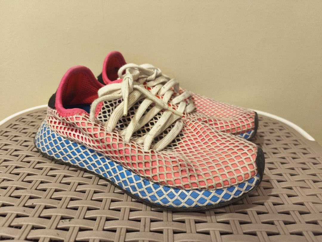 Adidas Deerupt Runner Pink Blue Net Sneakers (Category: Sneakers) located in Baguio. Submitted by zia_zab (Listing ID 1468529826, Image 1). Description: - Brand: Adidas Deerupt Runner - Colorway: Pink, white, and blue with black heel patches and bright blue insoles - Size: US 4.5 | UK 4 | FR 36 2/3 - Design: Iconic web-covered mesh upper with Trefoil logo and white laces - Condition: Pre-loved with minor dirt on the white laces and midsoles from 