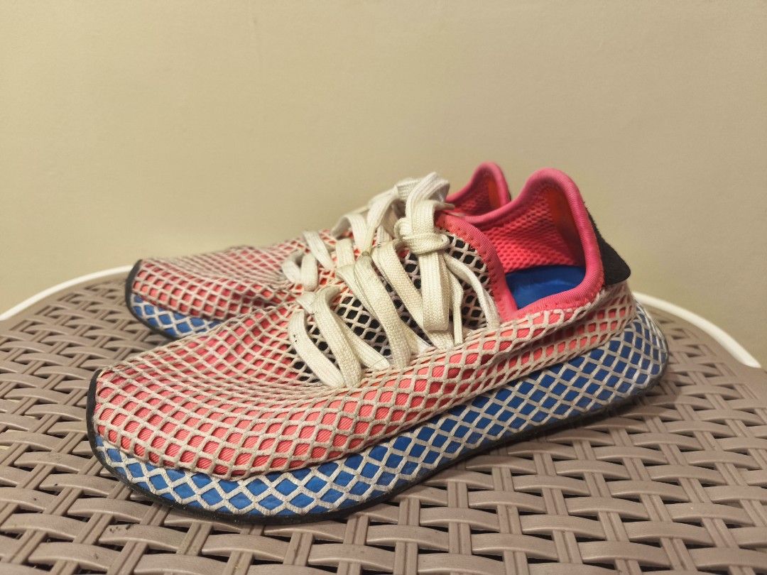 Adidas Deerupt Runner Pink Blue Net Sneakers (Category: Sneakers) located in Baguio. Submitted by zia_zab (Listing ID 1468529826, Image 3). Description: - Brand: Adidas Deerupt Runner - Colorway: Pink, white, and blue with black heel patches and bright blue insoles - Size: US 4.5 | UK 4 | FR 36 2/3 - Design: Iconic web-covered mesh upper with Trefoil logo and white laces - Condition: Pre-loved with minor dirt on the white laces and midsoles from 