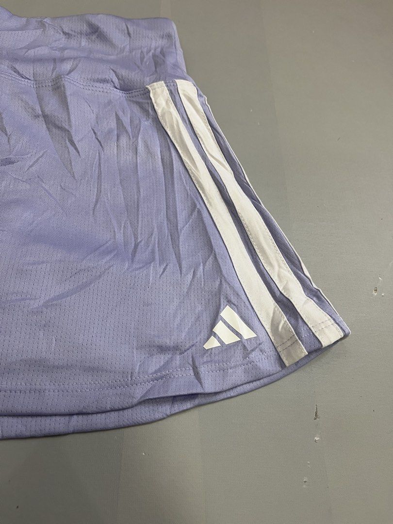 ADIDAS SKIRT (Category: Skirts) located in Mabalacat. Submitted by aas_thriftfings (Listing ID 1468577607, Image 2). Description: - Brand: Adidas - Style: Sports skort (skirt with built-in inner shorts) - Color: Light purple / lavender with white 3-stripes - Size: S (US 7/8) - Features: Breathable athletic fabric, elastic waistband, signature Adidas logo on the hem - Ideal for: Tennis, golf, badminton, working out, or casual streetwear.