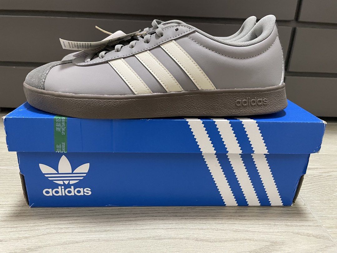 Adidas VL Court Base Grey (Category: Sneakers) located in San Fernando. Submitted by migifinds (Listing ID 1468577968, Image 3). Description: - Adidas VL Court Base sneakers - Color: Grey with off-white stripes - Features a grey suede toe cap - Brown sole - Size: US 9 - Condition: New with tags Pm me for more details 📩.