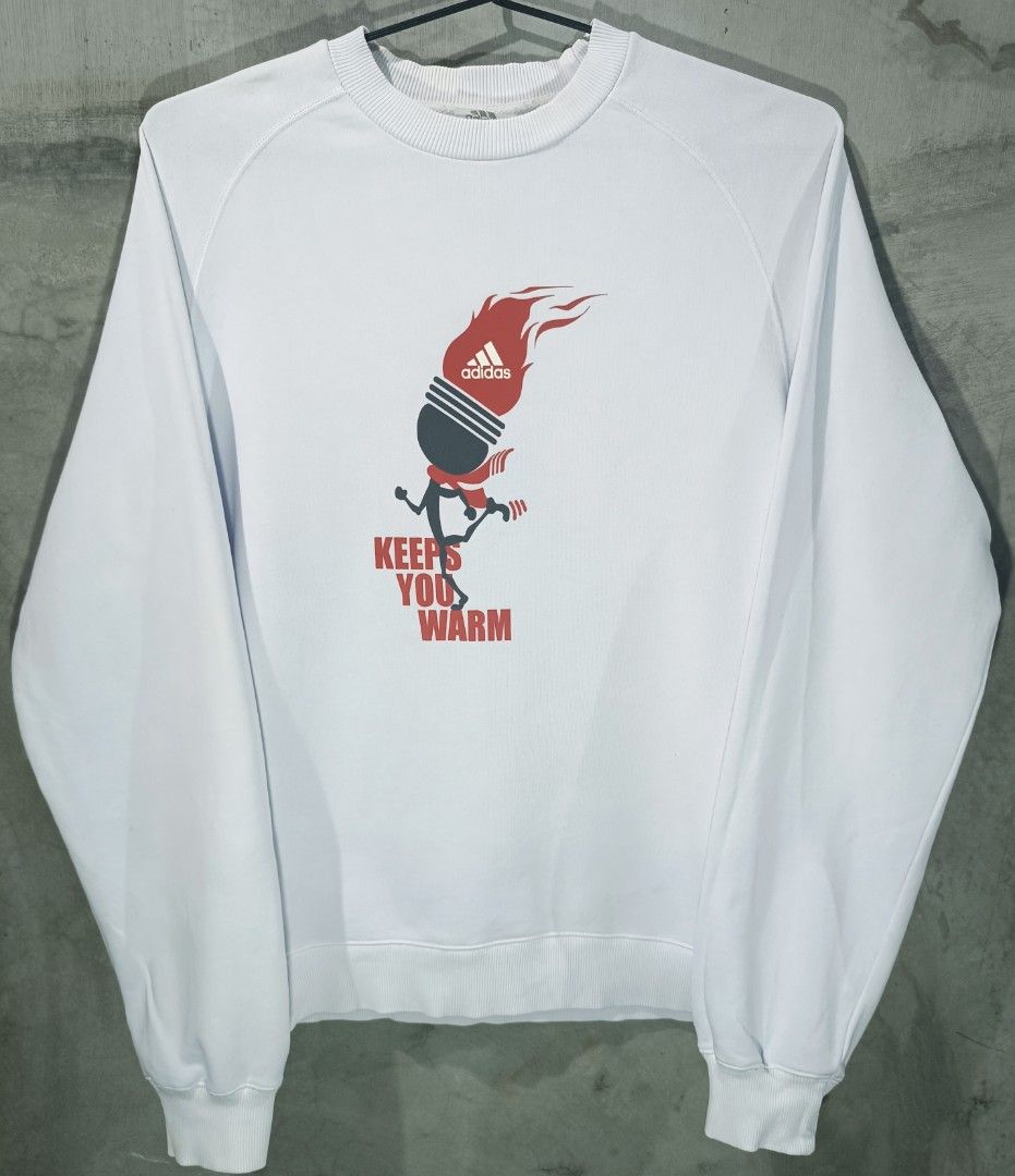 Adidas Winter Olympics Print Design White Sweatshirt (Category: Coats, Jackets and Outerwear) located in Bacoor. Submitted by nineties_kid (Listing ID 1468595098, Image 2). Description: <==• Adidas Winter Olympics Print Design White Sweatshirt Size: Medium Shoulder width: 17 inches Sleeve length: 28 inches Jacket width: 20.5 inches Jacket length: 27 inches _________________________ -Modes Of Delivery: J&T/Lalamove/ LBC (Cash on Pick-up/COD) -Meet