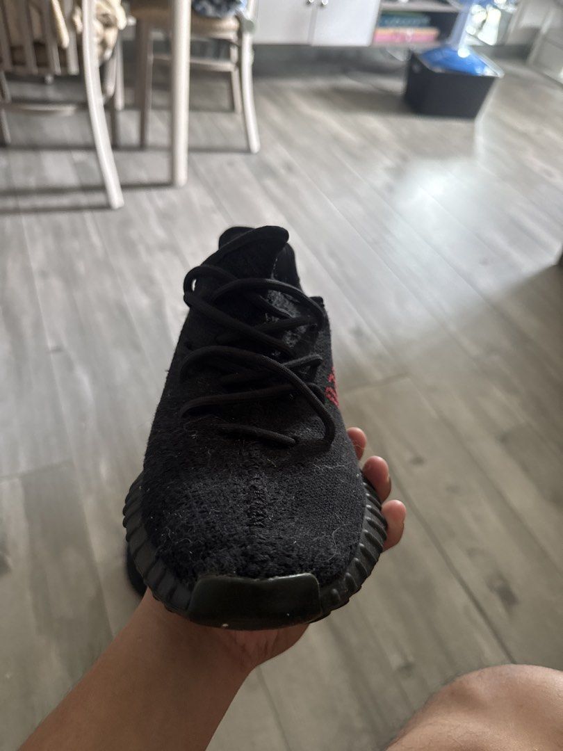 Adidas Yeezy Boost 350 V2 Core Black Red (Category: Sneakers) located in Pasig City. Submitted by jebgabriel24305 (Listing ID 1468514947, Image 2). Description: - Model: Yeezy Boost 350 V2 (Black & Red) - Upper: Primeknit with iconic red SPLY-350 branding - Sole: Ribbed rubber midsole with responsive Boost cushioning - Condition: Excellent, minimal signs of wear - Vibe: Perfect for everyday streetwear style.