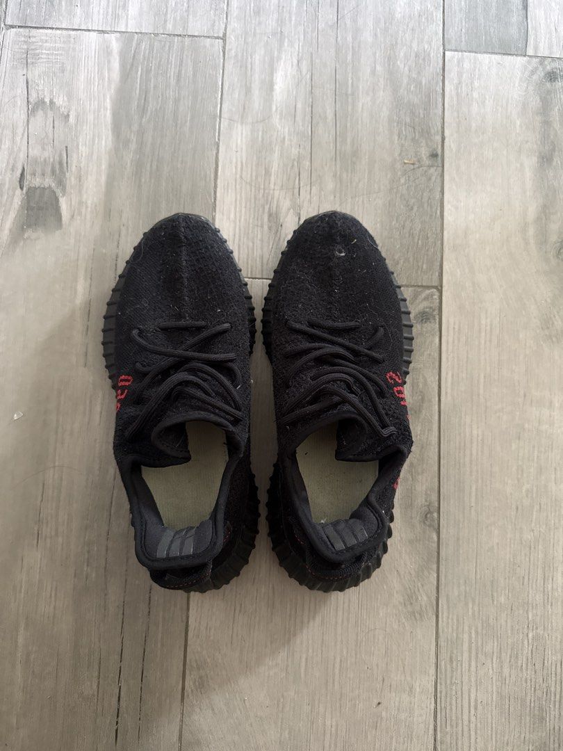 Adidas Yeezy Boost 350 V2 Core Black Red (Category: Sneakers) located in Pasig City. Submitted by jebgabriel24305 (Listing ID 1468514947, Image 1). Description: - Model: Yeezy Boost 350 V2 (Black & Red) - Upper: Primeknit with iconic red SPLY-350 branding - Sole: Ribbed rubber midsole with responsive Boost cushioning - Condition: Excellent, minimal signs of wear - Vibe: Perfect for everyday streetwear style.