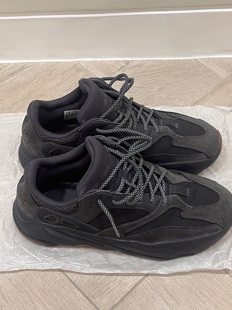 Adidas Yeezy Boost 700 Utility Black Size US 10 (Category: Sneakers) located in Quezon City. Submitted by adriangrafilo (Listing ID 1468622099, Image 2). Description: - Model: Adidas Yeezy Boost 700 Utility Black - Size: US 10 / UK 9.5 / FR 44 - Condition: Great pre-owned condition with clean insoles and readable size tag (05/19) - Details: Dark grey suede/mesh upper, chunky midsole, gum outsole, and reflective speckled rope laces - Style: Super 